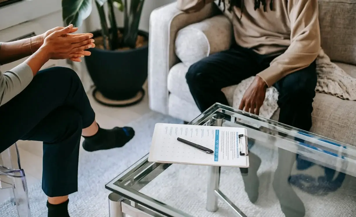 therapist and client seated across from each other therapist and client seated across from each other